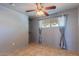 Cozy bedroom with tiled floors, soft gray walls, and ample closet space at 2625 N 40Th Dr, Phoenix, AZ 85009