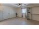 Bright bedroom featuring tiled floors, closet organizer, and lots of natural light at 2625 N 40Th Dr, Phoenix, AZ 85009
