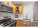 Updated kitchen with stainless appliances, quartz counters and light cabinets at 2625 N 40Th Dr, Phoenix, AZ 85009