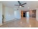 Spacious living room featuring tile floors and wood accent wall, perfect for entertaining at 2625 N 40Th Dr, Phoenix, AZ 85009