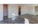 Spacious living area with tile flooring, leading to the modern kitchen and bath areas at 2625 N 40Th Dr, Phoenix, AZ 85009