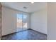 Bright room with tiled flooring, neutral walls, and sliding glass doors at 2625 N 40Th Dr, Phoenix, AZ 85009