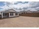 Backyard of home featuring block wall and view of the side of the house at 2823 N 212Th Dr, Buckeye, AZ 85396