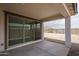 Covered outdoor patio with a view to mountains at 2823 N 212Th Dr, Buckeye, AZ 85396