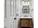 Charming bathroom with wooden vanity, white countertop, and black hardware at 2851 W Gold Dust Ave, San Tan Valley, AZ 85144