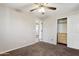 Bedroom with a ceiling fan, neutral walls, carpeted floor, and closet at 2851 W Gold Dust Ave, San Tan Valley, AZ 85144
