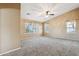 Spacious bedroom featuring plush carpeting, neutral walls, and large windows with nice curtains at 2851 W Gold Dust Ave, San Tan Valley, AZ 85144