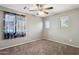 Bedroom with two windows and a ceiling fan at 2851 W Gold Dust Ave, San Tan Valley, AZ 85144