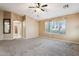 Large bedroom with plush carpet and open view of an en-suite bathroom at 2851 W Gold Dust Ave, San Tan Valley, AZ 85144