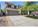 Inviting two-story home featuring a spacious driveway and well-maintained landscaping at 2851 W Gold Dust Ave, San Tan Valley, AZ 85144