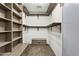 Well-organized walk-in closet with built-in shelves and ample storage space at 2851 W Gold Dust Ave, San Tan Valley, AZ 85144