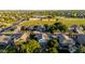 Beautiful neighborhood with lush greenery, a school, houses, and a view of the city in the background at 288 W Los Alamos St, Gilbert, AZ 85233