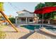 Lush backyard features a pool, patio, covered area, and string lights at 288 W Los Alamos St, Gilbert, AZ 85233