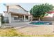 Inviting backyard with a pool, a patio, mature trees, and a covered patio area at 288 W Los Alamos St, Gilbert, AZ 85233