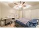 Bedroom featuring a window, ceiling fan, and closet at 288 W Los Alamos St, Gilbert, AZ 85233