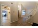 Grand foyer area features tiled floors and a staircase leading to the second floor, offering a bright and open feel at 288 W Los Alamos St, Gilbert, AZ 85233