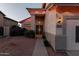 Inviting home exterior featuring desert landscaping, a tile roof, and decorative security door at the front entry at 288 W Los Alamos St, Gilbert, AZ 85233