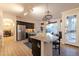 Well-equipped kitchen boasts granite countertops, stainless steel appliances, and a cozy breakfast nook with natural light at 288 W Los Alamos St, Gilbert, AZ 85233