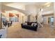 Bright living room featuring high ceilings, a modern staircase, and large windows for plenty of natural light at 288 W Los Alamos St, Gilbert, AZ 85233