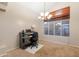 Cozy home office space featuring a traditional desk, rolling chair, and ambient natural light at 288 W Los Alamos St, Gilbert, AZ 85233