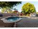 Enjoy a beautiful backyard oasis with a sparkling pool, playhouse and lush greenery for year-round outdoor enjoyment at 288 W Los Alamos St, Gilbert, AZ 85233