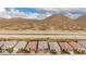 Scenic aerial view of a neighborhood with desert mountain backdrop and canal at 28931 N 64Th Dr, Phoenix, AZ 85083
