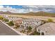 Aerial view of an elegant two-story home in a quiet neighborhood with mountain views at 28931 N 64Th Dr, Phoenix, AZ 85083