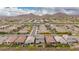Picturesque aerial of a neighborhood nestled against the desert mountains at 28931 N 64Th Dr, Phoenix, AZ 85083