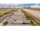 Scenic aerial view of a residential neighborhood and mountain views at 28931 N 64Th Dr, Phoenix, AZ 85083