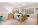 Comfortable bedroom with plush carpet, stylish window shutters, and elegant furniture offering a serene retreat at 28931 N 64Th Dr, Phoenix, AZ 85083