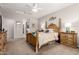 Inviting bedroom features plush carpet, neutral walls, and comfortable furniture creating a relaxing retreat at 28931 N 64Th Dr, Phoenix, AZ 85083