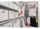 Walk-in closet with custom organization solutions for clothes and accessories at 28931 N 64Th Dr, Phoenix, AZ 85083