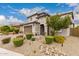 Two story home with desert landscaping, two car garage, and tile roof at 28931 N 64Th Dr, Phoenix, AZ 85083