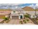 Elegant two-story home with well-maintained desert landscaping, driveway, and beautiful mountain views at 28931 N 64Th Dr, Phoenix, AZ 85083
