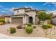 Charming two-story home boasting beautiful desert landscaping, a tile roof, and a two-car garage at 28931 N 64Th Dr, Phoenix, AZ 85083