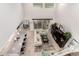 Aerial view of an open-concept living space with modern kitchen, dining area, and comfortable living room at 28931 N 64Th Dr, Phoenix, AZ 85083