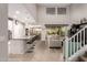 Open-concept living space with modern kitchen, dining area, and a comfortable living room with plenty of natural light at 28931 N 64Th Dr, Phoenix, AZ 85083