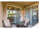 Cozy balcony featuring patio seating and sliding glass doors with views of the community at 2929 W Yorkshire Dr # 1066, Phoenix, AZ 85027