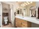 Bright bathroom with a single sink vanity, white countertops, and access to a tiled shower at 2929 W Yorkshire Dr # 1066, Phoenix, AZ 85027