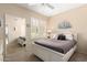 Bright bedroom featuring a neutral color palette, white wood bedframe and shuttered windows at 2929 W Yorkshire Dr # 1066, Phoenix, AZ 85027
