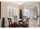 Eat-in dining area features a glass table, four chairs, and sliding glass doors at 2929 W Yorkshire Dr # 1066, Phoenix, AZ 85027