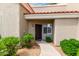 Home exterior showcasing desert landscaping leading to a dark wood front door at 2929 W Yorkshire Dr # 1066, Phoenix, AZ 85027