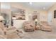 Comfortable living room with tan upholstered reclining furniture adjacent to a breakfast bar at 2929 W Yorkshire Dr # 1066, Phoenix, AZ 85027