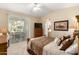 Bright main bedroom features large sliding doors, a ceiling fan, and carpeted floors at 2929 W Yorkshire Dr # 1066, Phoenix, AZ 85027