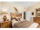 Cozy main bedroom with decorative headboard, wooden furniture, and view into walk in closet at 2929 W Yorkshire Dr # 1066, Phoenix, AZ 85027