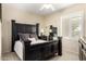 Well-appointed main bedroom with elegant bed frame, side tables, and ample natural light at 2929 W Yorkshire Dr # 1066, Phoenix, AZ 85027