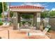 Community pool area with covered seating and lounge chairs, perfect for relaxation and socializing at 2929 W Yorkshire Dr # 1066, Phoenix, AZ 85027