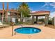 Community spa features pristine blue water, landscaping, and covered seating, providing a resort-like experience at 2929 W Yorkshire Dr # 1066, Phoenix, AZ 85027