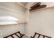 Empty walk-in closet with carpet, basic shelving and plenty of room to hang and store clothes at 2929 W Yorkshire Dr # 1066, Phoenix, AZ 85027