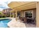 Inviting backyard with covered patio, dining set and shimmering pool at 3387 E Bluejay Dr, Chandler, AZ 85286